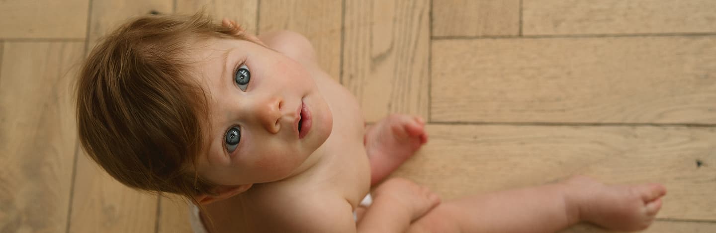 Baby on wooden floor
